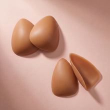 The Sculpt in Honey, the pair standing with a third piece turned to show the adhesive face