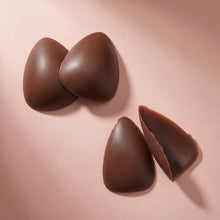 The Sculpt in Cocoa, the pair standing with a third piece turned to show the adhesive face