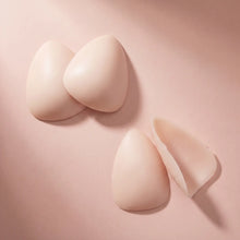The Sculpt in Nude, the pair standing with a third piece turned to show the adhesive face